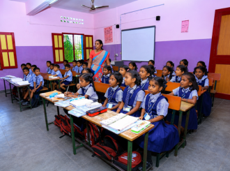 JMJ School students learning with their teacher in the classroom